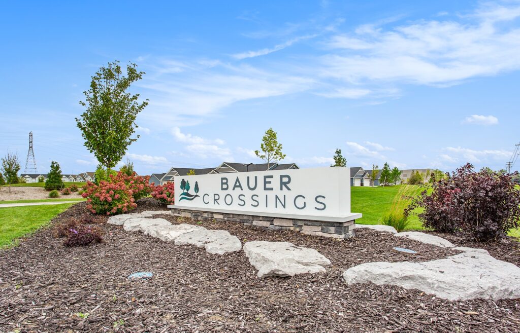 The Bauer Crossings property sign
